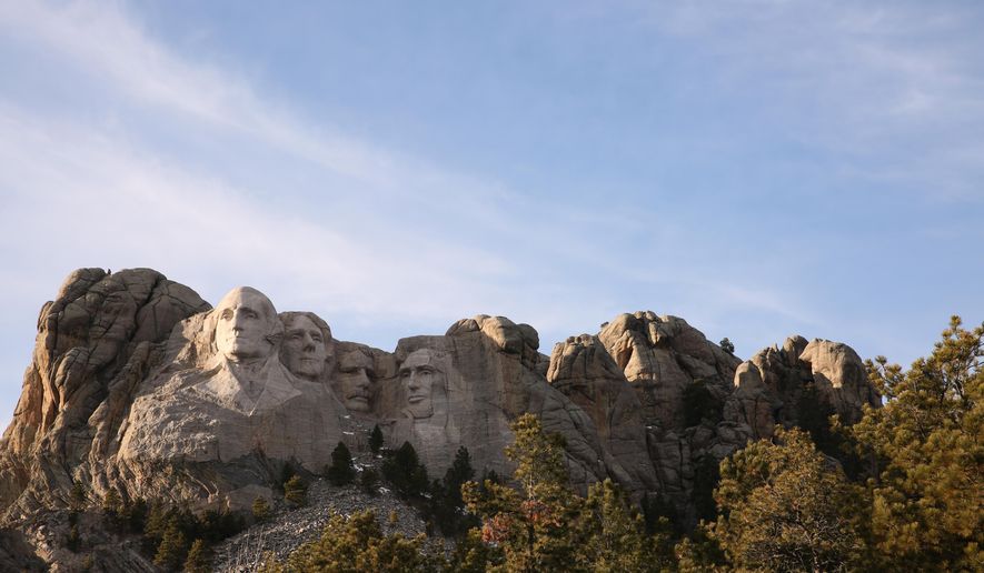 This Dec. 8, 2019, photo shows shows Mount Rushmore in Keystone, S.D. Organizers have scrapped plans to mandate social distancing during President Donald Trump's appearance at a July 3, 2020, Mount Rushmore fireworks display and won't limit the crowd due to coronavirus concerns, South Dakota Gov. Kristi Noem said Thursday, June 4, 2020. The Republican governor said the National Park Service is dolling out 7,500 tickets via lottery for the event, which marks the first time in a decade that fireworks will be set off at the memorial in recognition of Independence Day. (AP Photo/Stephen Groves)