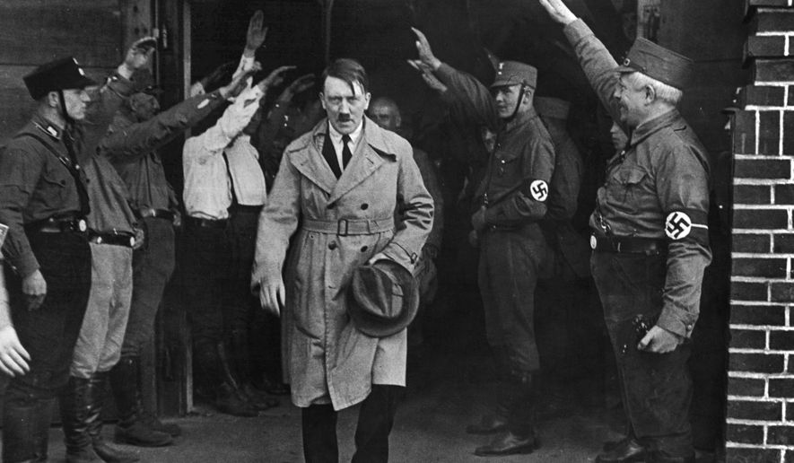 In this Dec. 5, 1931 file photo Adolf Hitler, leader of the National Socialists, leaves the party&#39;s Munich, Germany headquarters. (AP Photo/File)