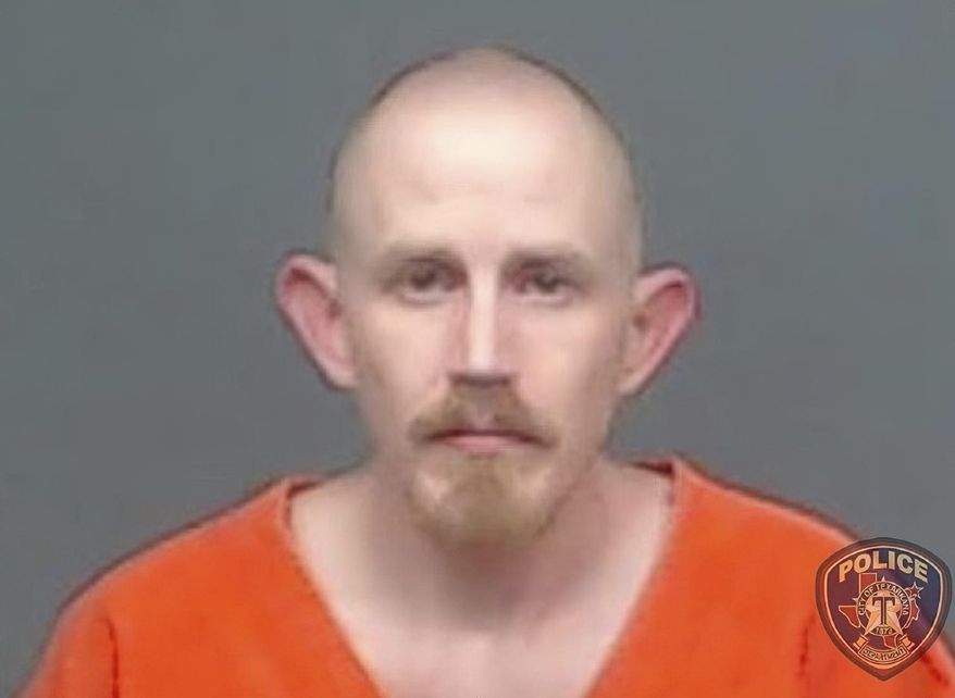 FILE - In this file image provided by the Texarkana, Texas, Police Department, Aaron Swenson is seen in his police booking photo. The Arkansas man whose Facebook page included "boogaloo" references was arrested on April 11, 2020 by police in Texarkana, Texas, on a charge he threatened to ambush and kill a police officer on a Facebook Live video. He was indicted June, 11, 2020, on charges including attempt to commit capital murder of a peace officer. (Texarkana Police Department via AP)