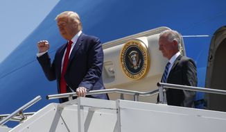 President Donald Trump gestures as he steps off Air Force One at Dallas Love Field, Thursday, June 11, 2020, in Dallas with Senate candidate Tommy Tuberville.(AP Photo/Alex Brandon)