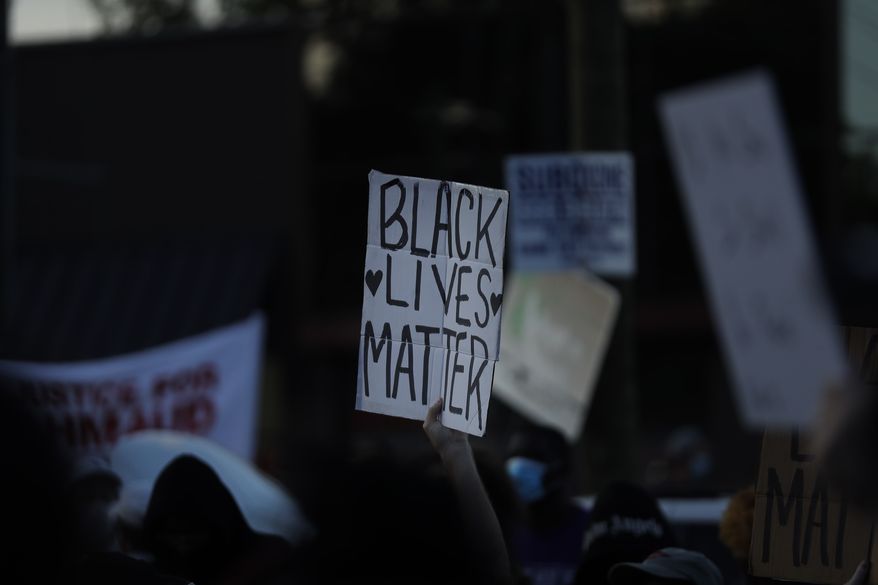 A &quot;Black Lives Matter&quot; sign is seen during protests on Saturday, June 13, 2020, near the Atlanta Wendy&#39;s where Rayshard Brooks was shot and killed by police Friday evening following a struggle in the restaurant&#39;s drive-thru line in Atlanta. (AP Photo/Brynn Anderson)