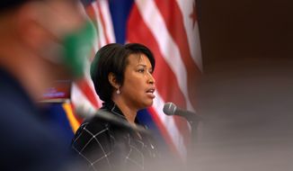 Witnesses at Monday&#39;s Justice and Public Safety Committee hearing want D.C. Mayor Muriel Bowser&#39;s revised fiscal 2021 budget, which includes a 3.3% increase for police, to be rejected. (ASSOCIATED PRESS)