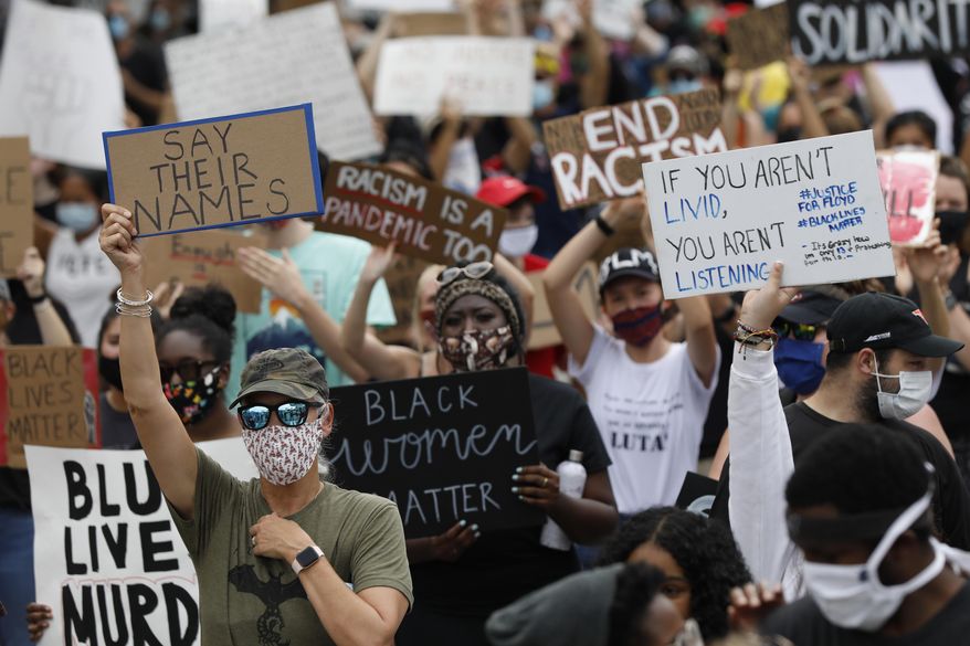 Protesters fill College Avenue during the Athens Anti Discrimination Movement 'Justice For Black Lives Rally' for the deaths of George Floyd, Breonna Taylor and Ahmaud Arbery in downtown Athens, Ga, on Saturday, June 6, 2020. (Joshua L. Jones/Athens Banner-Herald via AP)