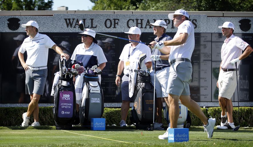 Jordan Spieth, left, watches Ryan Palmer tee off the first hole during practice for the Charles Schwab Challenge golf tournament at the Colonial Country Club in Fort Worth, Texas, Tuesday, June 9, 2020. The Challenge is the first PGA tour event since the COVID-19 pandemic began. (Tom Fox/The Dallas Morning News via AP)