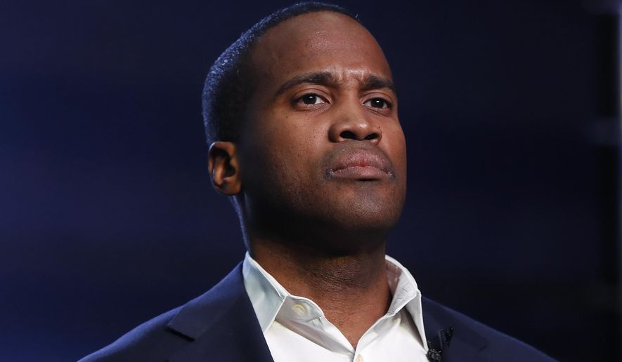 FILE - In this Oct. 17, 2018, file photo, Republican U.S. Senate candidate John James speaks during a rally in Pontiac, Mich. James appeared with President Donald Trump in May in Michigan, where polls have trended against the president, James demurred when asked about his 2017 comment that he backs Trump “2,000%.” James said he supports Trump, adding, “I’m looking forward to running my own race, being my own man.” (AP Photo/Paul Sancya, File)