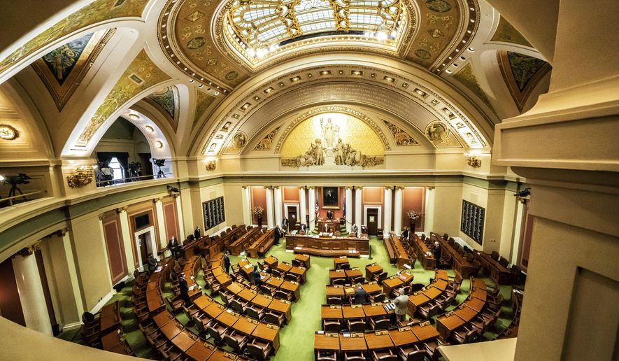 Democratic House Speaker Melissa Hortman, of Brooklyn Park calls for members to stand in silence and bow their heads for 8 Minutes and 46 seconds in honor of George Floyd Friday, June 12, 2020, as the Minnesota State Legislature met in a special session. (Glen Stubbe/Star Tribune via AP)