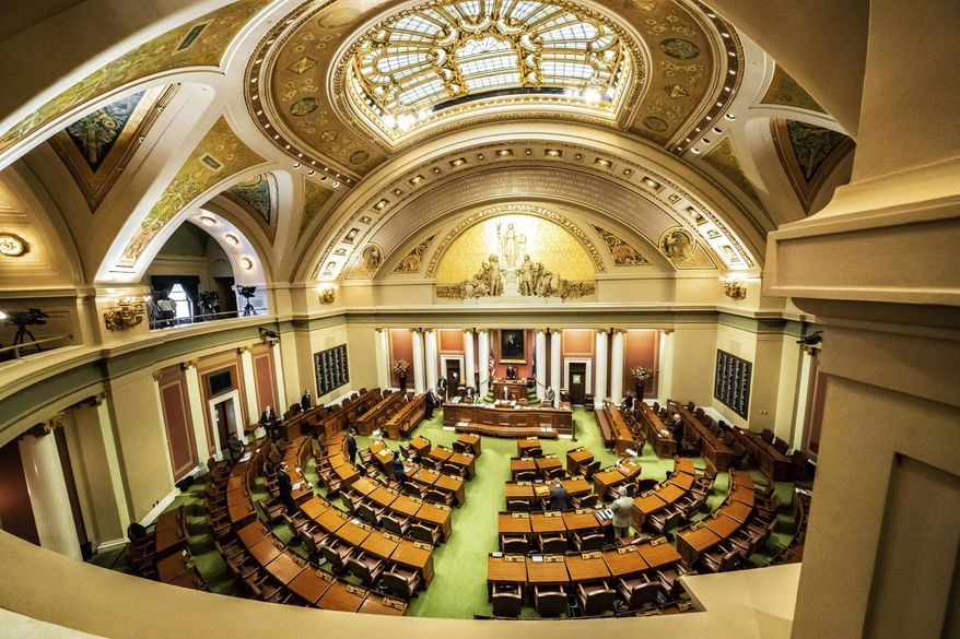 Democratic House Speaker Melissa Hortman, of Brooklyn Park calls for members to stand in silence and bow their heads for 8 Minutes and 46 seconds in honor of George Floyd Friday, June 12, 2020, as the Minnesota State Legislature met in a special session. (Glen Stubbe/Star Tribune via AP)