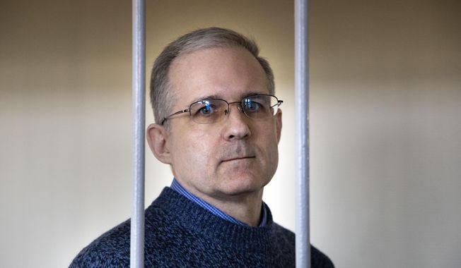 In this Aug. 23, 2019, file photo, Paul Whelan, a former U.S. Marine who was arrested for alleged spying in Moscow on Dec. 28, 2018, speaks while standing in a cage as he waits for a hearing in a courtroom in Moscow, Russia. (AP Photo/Alexander Zemlianichenko, File)