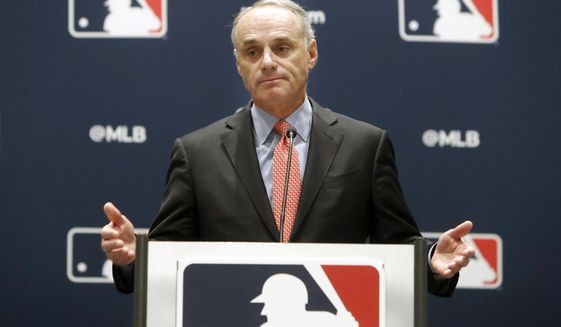 FILE - In this Nov. 21, 2019, file photo, baseball commissioner Rob Manfred speaks to the media at the owners meeting in Arlington, Texas. The chance that there will be no Major League Baseball season increased substantially Monday, June 15, 2020, when the commissioner&#39;s office told the players&#39; association it will not proceed with a schedule amid the coronavirus pandemic unless the union waives its right to claim management violated a March agreement between the feuding sides. (AP Photo/LM Otero, File)