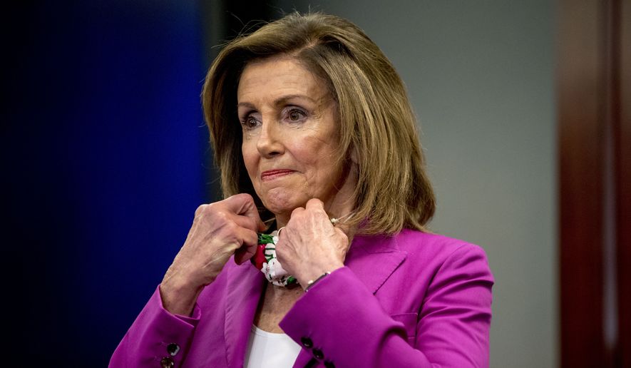 House Speaker Nancy Pelosi of Calif., puts her mask back on after speaking at a news conference on District of Columbia statehood on Capitol Hill, Tuesday, June 16, 2020, in Washington. House Majority Leader Steny Hoyer of Md. will hold a vote on D.C. statehood on July 26. (AP Photo/Andrew Harnik) **FILE**