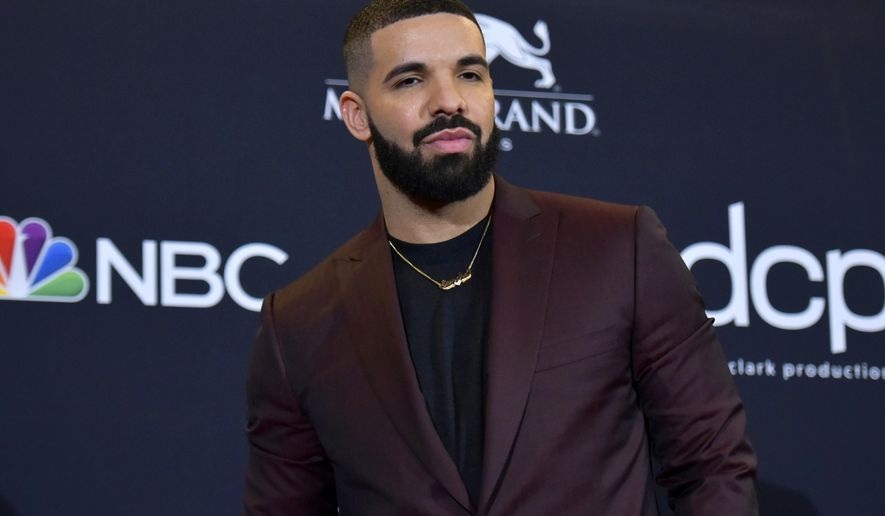 FILE - This May 1, 2019 file photo shows Drake at the Billboard Music Awards in Las Vegas. Drake is the leading nominee at the 2020 BET Awards, which will celebrate its 20th anniversary later this month. BET announced Monday that Drake is nominated for six honors, including video of the year and best male hip-hop artist. For both best collaboration and the viewer's choice award, Drake is nominated twice thanks to the hits "No Guidance" with Chris Brown and "Life Is Good" with Future. (Photo by Richard Shotwell/Invision/AP, File)