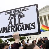 In this Oct. 8, 2019, file photo, protesters gather outside the Supreme Court in Washington where the Supreme Court is hearing arguments in the first case of LGBT rights since the retirement of Supreme Court Justice Anthony Kennedy. LGBT-rights activists are looking ahead as they celebrate a major victory in the Supreme Court regarding job discrimination, They hope the June 15, 2020, decision spurs action against other forms of bias against their community and undermines the Trump administration’s near-total ban on military service by transgender people. (AP Photo/Susan Walsh, File)