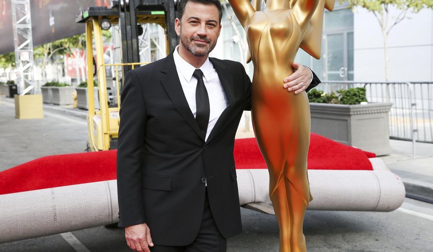 FILE - This Sept. 14, 2016 file photo shows host Jimmy Kimmel posing for a photo with a replica of an Emmy statue at the Primetime Emmy Awards Press Preview Day in Los Angeles. Kimmel will return as host and will serve as executive producer for the 72nd Emmy Awards. The show will be broadcast, Sunday, Sept. 20, on ABC. (Photo by Rich Fury/Invision/AP, File)