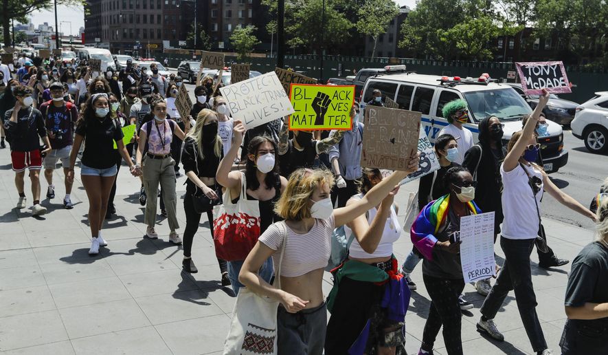 Protesters gather as part of a solidarity rally calling for justice over the death of George Floyd, and to highlight police brutality nationwide, Wednesday, June 17, 2020, in the Brooklyn borough of New York. (AP Photo/Frank Franklin II) ** FILE **