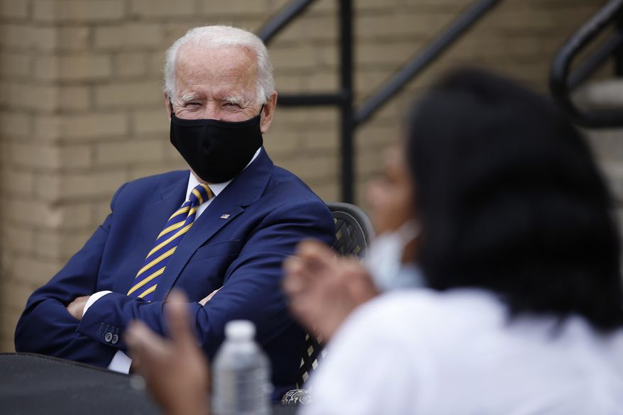 Democratic presidential candidate, former Vice President Joe Biden, left, listens as Carlette Brooks, owner of Carlette&#39;s Hideaway, a soul food restaurant, talks during a meeting with small business owners, Wednesday, June 17, 2020, in Yeadon, Pa. (AP Photo/Matt Slocum) ** FILE **