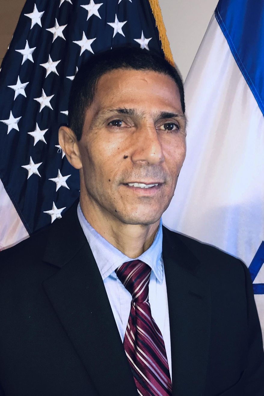 This November, 25, 2019 photo provided by the Israeli Foreign Ministry shows Israel's first Bedouin Arab diplomat Ishmael Khaldi in Miami, Florida. Khaldi who was once deployed abroad to push back against Israel's critics said he was beaten by overzealous security guards at Jerusalem’s central bus station on Thursday, June 11, 2020. Khaldi said he believes it was a case of ethnic profiling. He said he filed a police complaint and went public with his experience in order to shine a light on racist behavior that he says exists in sectors of the country that he loves. (Israeli Consulate in Miami via AP)