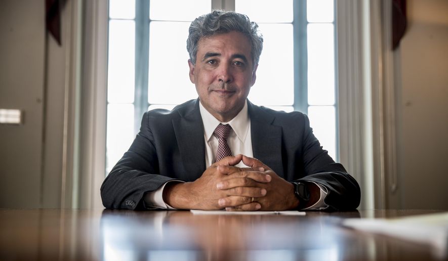 FILE - In this May 21, 2019, file photo, Solicitor General Noel Francisco poses for a photograph at the Department of Justice in Washington. Francisco, who as the Trump administration&#39;s top Supreme Court lawyer defended controversial policies including the president&#39;s travel ban, push to add a citizenship question to the census and decision to restrict service in the military by transgender people, is leaving the job. (AP Photo/Andrew Harnik, File)