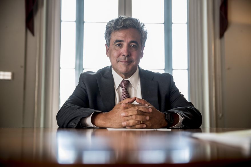 FILE - In this May 21, 2019, file photo, Solicitor General Noel Francisco poses for a photograph at the Department of Justice in Washington. Francisco, who as the Trump administration&#39;s top Supreme Court lawyer defended controversial policies including the president&#39;s travel ban, push to add a citizenship question to the census and decision to restrict service in the military by transgender people, is leaving the job. (AP Photo/Andrew Harnik, File)