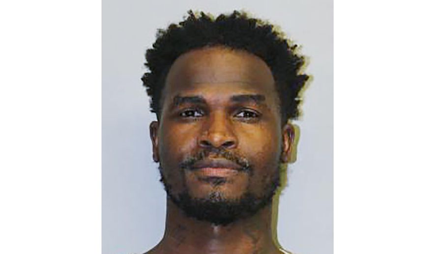 FILE - This undated file booking photo provided by the Hawaii Police Department shows Eligio Bishop. Most of the 21 people who call themselves a misunderstood, nature-loving family, remained jailed Tuesday, June 16, 2020, over allegedly violating Hawaii’s traveler quarantine, even after they agreed to return to Los Angeles. Bishop, leader of the group known as Carbon Nation, was released with two others Monday after he pleaded no contest to violating Hawaii's quarantine, which is meant to curb the spread of the coronavirus in the islands. (Hawaii Police Department via AP, File)