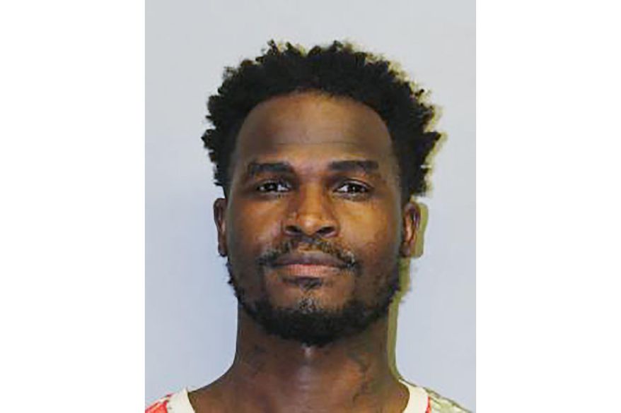 FILE - This undated file booking photo provided by the Hawaii Police Department shows Eligio Bishop. Most of the 21 people who call themselves a misunderstood, nature-loving family, remained jailed Tuesday, June 16, 2020, over allegedly violating Hawaii’s traveler quarantine, even after they agreed to return to Los Angeles. Bishop, leader of the group known as Carbon Nation, was released with two others Monday after he pleaded no contest to violating Hawaii's quarantine, which is meant to curb the spread of the coronavirus in the islands. (Hawaii Police Department via AP, File)