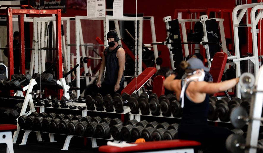 Forty-four states have already allowed gyms to reopen at least partially with some restrictions. New safety protocols include spreading out exercise machines, more hand sanitizers and closures for cleaning. (ASSOCIATED PRESS)