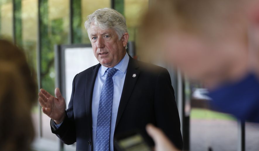 Virginia Attorney General Mark Herring gestures as he speaks with reporters outside of the Richmond General District Court Thursday, June 18, 2020, in Richmond, Va. (AP Photo/Steve Helber) ** FILE **