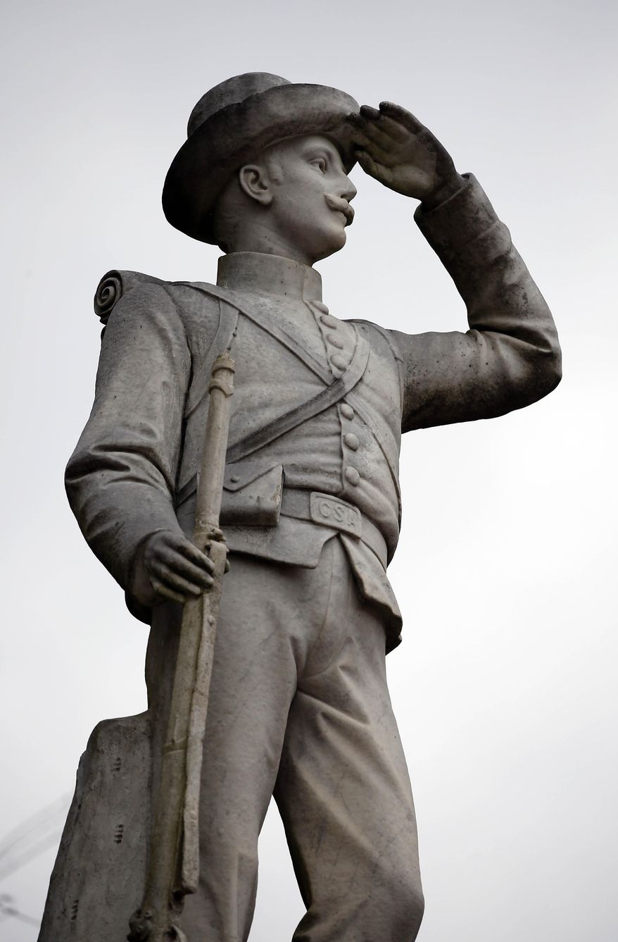 In this Feb. 23, 2019, file photo, a Confederate soldier monument stands at the University of Mississippi in Oxford, Miss. The monument will be moved from the prominent spot at the university to a Civil War cemetery in a secluded part of the Oxford campus. (AP Photo/Rogelio V. Solis, File)