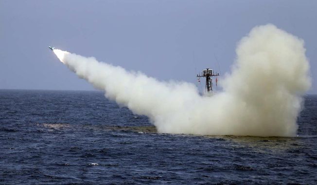 In this photo provided Thursday, June 18, 2020, by the Iranian Army, a warship launches a missile during a naval exercise. State media reported Thursday that Iran test fired cruise missiles in a naval exercise in the Gulf of Oman and northern Indian Ocean. The report by the official IRNA news agency said the missiles destroyed targets at a distance of 280 kilometers (170 miles). (Iranian Army via AP)