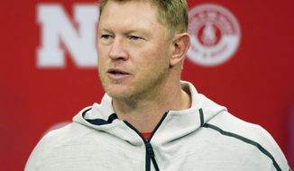 FILE - In this March 5, 2019, file photo, Nebraska NCAA college football coach Scott Frost answers a question during a news conference in Lincoln, Neb. Nebraska football coach Scott Frost and men&#x27;s basketball coach Fred Hoiberg will donate a portion of their salaries to the athletic department&#x27;s general operating fund to help offset revenue shortfalls because of the coronavirus pandemic. The athletic department said in a statement Thursday, June 18, 2020, the amount of the donations would be determined when the 2021 budget is closer to being finalized. Frost&#x27;s salary is $5 million this year. Hoiberg is set to earn $3 million. (AP Photo/Nati Harnik, File)