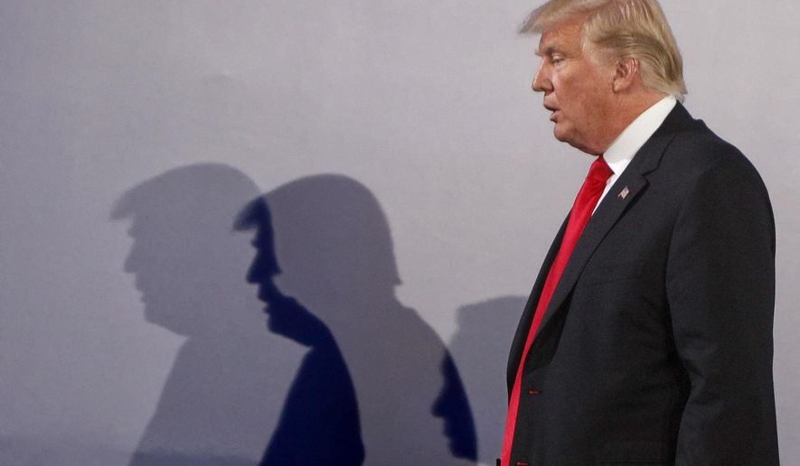 File -- In this Thursday, July 6, 2017 file photo U.S. President Donald Trump casts shadows on the wall as he walks with Poland's President Andrzej Duda at the end of a joint press conference, in Warsaw, Poland. Trump and Duda will meet at the White House on June 24, four days ahead of a presidential election in Poland in which Duda, a conservative, is seeking reelection. The meeting is expected to give Duda a boost, and is seen by some as election interference. (AP Photo/Czarek Sokolowski/file)