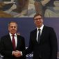 Russian Foreign Minister Sergey Lavrov, left, shakes hands with Serbia&#39;s President Aleksandar Vucic after a joint press conference in Belgrade, Serbia, Thursday, June 18, 2020. Lavrov is on a two-day official visit to Serbia. (AP Photo/Darko Vojinovic)