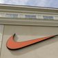 FILE - In this file photo dated Tuesday, Sept. 4, 2018, a Nike company logo is displayed outside a Nike store in Charlotte, N.C.  More than 460 companies, including Nike, Twitter and Lyft, have joined a pledge to observe Juneteenth, with the majority offering a paid day off, according to HellaCreative, a group of black creative professionals in the Bay Area that launched the initiative as part of a campaign to make the day a federal holiday. (AP Photo/Chuck Burton, FILE)