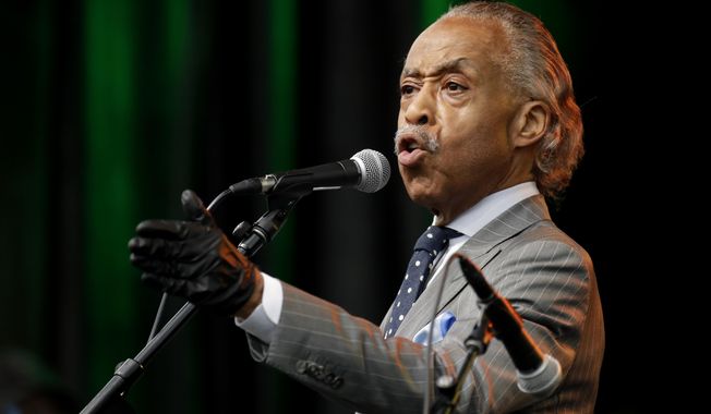 The Rev. Al Sharpton addresses the crowd at a Juneteenth rally in Tulsa, Okla., Friday, June 19, 2020. Juneteenth marks the day in 1865 when federal troops arrived in Galveston, Texas, to take control of the state and ensure all enslaved people be freed, more than two years after the Emancipation Proclamation. (AP Photo/Charlie Riedel)