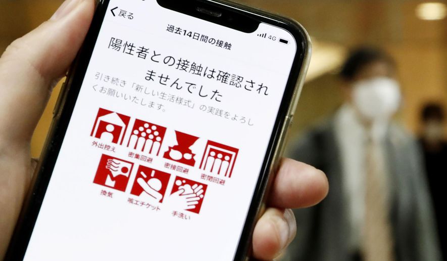 The smartphone screen, seen in Tokyo, Japan, shows a trial version of the COVID-19 Contact Confirming Application, or COCOA, released Friday, June 19, 2020, by the Ministry of Health, Labor and Welfare. The notice says &amp;quot;There was no close contact.&amp;quot; The coronavirus tracing app is designed to alert users if they come in contact with someone tested positive for the coronavirus.  Once installed, the app logs data via Bluetooth from phones that stay in close proximity for over 15 minutes.(Kyodo News via AP)