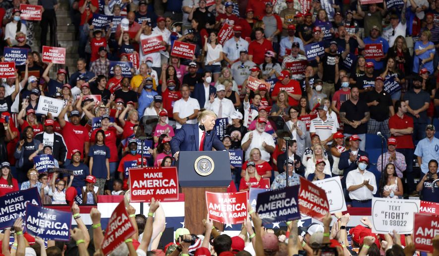 President Donald Trump, front center, speaks at BOK Center during his rally in Tulsa, Okla., Saturday, June 20, 2020. (Stephen Pingry/Tulsa World via AP)