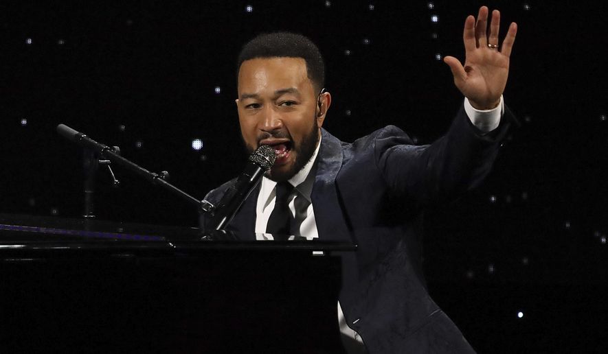 FILE - This March 5, 2020 file photo shows John Legend performing at The Alliance for Children's Rights 28th Annual Dinner in Beverly Hills, Calif. John Legend, Gabrielle Union and Ava DuVernay are some of the many black cultural leaders who have signed a letter to fight against racism, promote equal pay and ask industries to disassociate from police. The letter was released Friday, June 19, 2020 by a new organization called the Black Artists for Freedom, which describes itself as a collective of black workers in the culture industries. (Photo by Willy Sanjuan/Invision/AP, File)