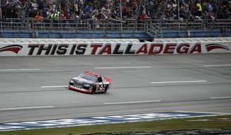 FILE - In this Oct. 13, 2019 file photo, the No. 3 car of the late NASCAR driver Dale Earnhardt Sr., driven by Richard Childress, takes a lap before a NASCAR Cup Series auto race at Talladega Superspeedway in Talladega, Ala.   NASCAR&#39;s return to racing next shifts to Talladega Superspeedway in Alabama, with a new rules package altered after Ryan Newman&#39;s frightful crash in the season-opening Daytona 500.  (AP Photo/Butch Dill)