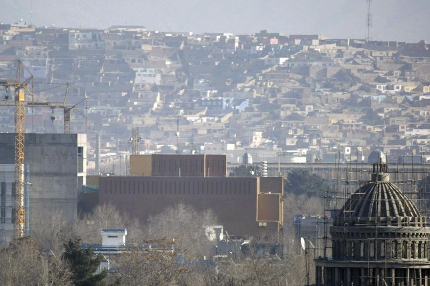 FILE - This Dec. 25, 2013, filer, photo shows a general view of the U.S. Embassy in Kabul, Afghanistan after it was hit by rocket fire in Kabul, Afghanistan. The U.S. State Department says Saturday, June 20, 2020 that COVID-19 infections have been reported at its embassy in the Afghan capital and the staff who are affected include diplomats, contractors and locally employed staff. (AP Photo/Ahmad Nazar)