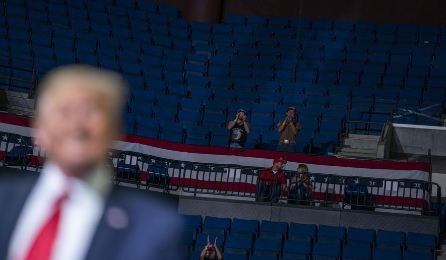 President Donald Trump supporters cheer as Trump speaks during a campaign rally at the BOK Center, Saturday, June 20, 2020, in Tulsa, Okla. (AP Photo/Evan Vucci)