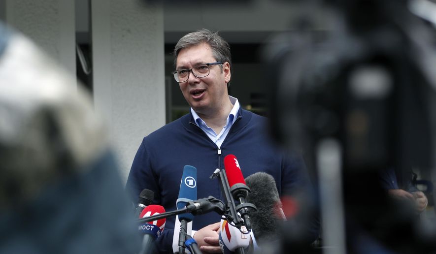 Serbia&#39;s President Aleksandar Vucic, addresses the media outside a polling station, in Belgrade, Serbia, Sunday, June 21, 2020. Serbia&#39;s ruling populists are set to tighten their hold on power in a Sunday parliamentary election held amid concerns over the spread of the coronavirus in the Balkan country and a partial boycott by the opposition. (AP Photo/Darko Vojinovic)