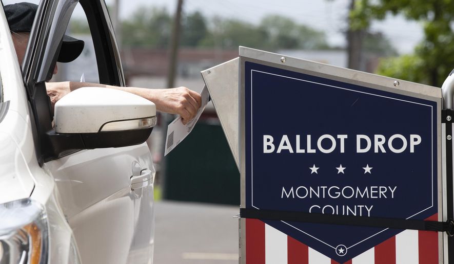 FILE - In this May 27, 2020, file photo, a voter drops off their mail-in ballot prior to the primary election, in Willow Grove, Pa. The civic ritual of casting a ballot has been disrupted by a global pandemic and dramatically animated by social unrest. And If the results of a frustrating, chaotic primary in Georgia are a measure, the notion of democracy itself will also be on the ballot in the November election. Congress is now considering sending $3.6 billion to states to help facilitate safe and fair elections as part of another round of relief funds to recover from the coronavirus pandemic. (AP Photo/Matt Rourke, File)