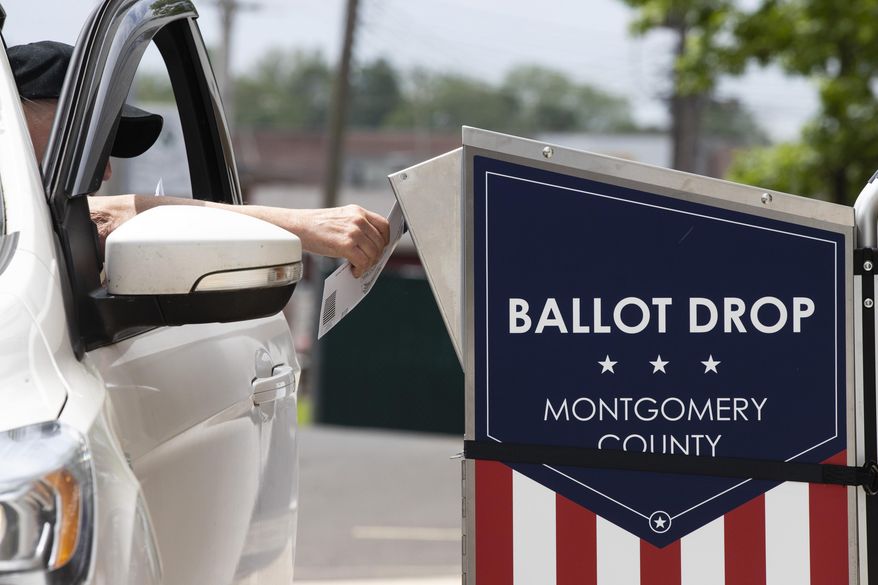 FILE - In this May 27, 2020, file photo, a voter drops off their mail-in ballot prior to the primary election, in Willow Grove, Pa. The civic ritual of casting a ballot has been disrupted by a global pandemic and dramatically animated by social unrest. And If the results of a frustrating, chaotic primary in Georgia are a measure, the notion of democracy itself will also be on the ballot in the November election. Congress is now considering sending $3.6 billion to states to help facilitate safe and fair elections as part of another round of relief funds to recover from the coronavirus pandemic. (AP Photo/Matt Rourke, File)