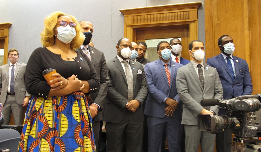 Black lawmakers stand in support of a bill by Rep. Edmond Jordan, D-Baton Rouge, that would eliminate police officers' wide-ranging immunity from civil lawsuits for damages for injury or death, on Wednesday, June 17, 2020, in Baton Rouge, La. The House Civil Law and Procedure Committee rejected the bill. (AP Photo/Melinda Deslatte)