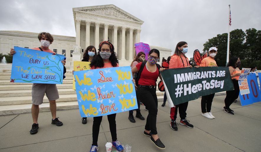 Deferred Action for Childhood Arrivals (DACA) students celebrate in front of the Supreme Court after the Supreme Court rejected President Donald Trump's effort to end legal protections for young immigrants, Thursday, June 18, 2020, in Washington. (AP Photo/Manuel Balce Ceneta)