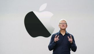 In this photo provided by Apple Inc., CEO Tim Cook delivers the keynote address during the 2020 Apple Worldwide Developers Conference Monday, June 22, 2020, in Cupertino, Calif. (Brooks Kraft/Apple Inc. via AP) ** FILE **