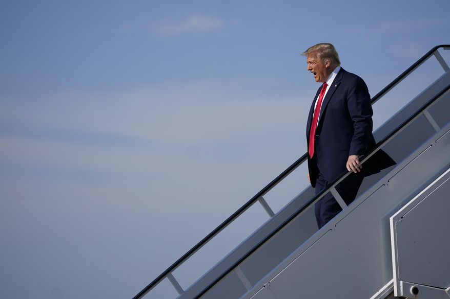 President Donald Trump exits Air Force One as he arrives at Tulsa International Airport on Saturday, June 20, 2020, in Tulsa, Okla. (AP Photo/Evan Vucci)