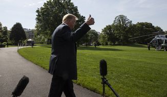President Donald Trump gives thumbs after speaking with reporters before departing on Marine One on the South Lawn of the White House, Tuesday, June 23, 2020, in Washington. (AP Photo/Alex Brandon)
