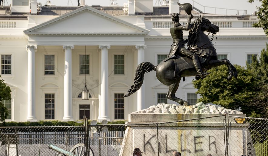 The White House is visible behind a statue of President Andrew Jackson in Lafayette Park, Tuesday, June 23, 2020, in Washington, with the word &quot;Killer&quot; spray painted on its base. Protesters tried to topple the statue Monday night. On Saturday, June 27, it was announced that four individuals who had tried to topple the statue were identified, one of whom has already had his initial appearance in court.  (AP Photo/Andrew Harnik)  **FILE**