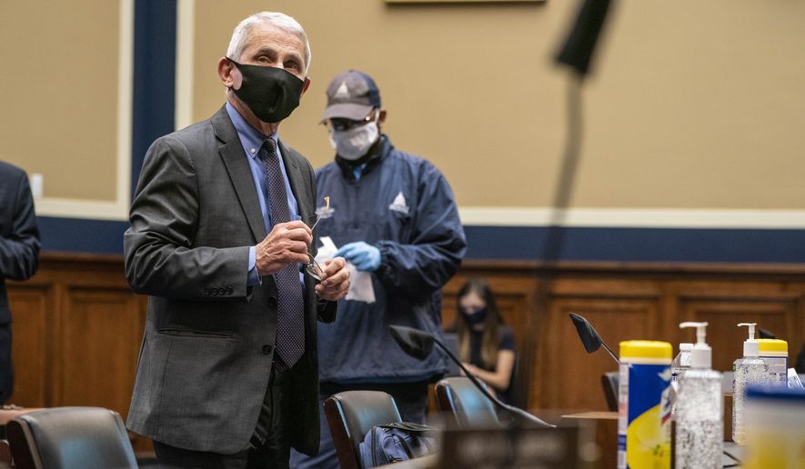 Director of the National Institute of Allergy and Infectious Diseases Dr. Anthony Fauci arrives to testify before a House Committee on Energy and Commerce on the Trump administration&#39;s response to the COVID-19 pandemic on Capitol Hill in Washington on Tuesday, June 23, 2020. (Sarah Silbiger/Pool via AP)