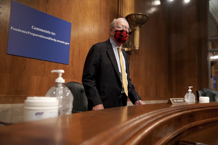 Committee Chairman Sen. Lamar Alexander, R-Tenn., arrives for a Senate Health, Education, Labor and Pensions Committee hearing, Tuesday, June 23, 2020, on Capitol Hill in Washington, to discuss the lessons learned during the coronavirus. (Greg Nash/Pool via AP)